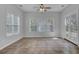 Bright sunroom with tile floors, multiple windows, and French doors leading outdoors at 124 Sweet Alyssum Dr, Ladson, SC 29456