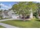 Two story house with front porch and attached garage at 124 Sweet Alyssum Dr, Ladson, SC 29456