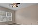 Simple bedroom with ceiling fan and large window at 124 Sweet Alyssum Dr, Ladson, SC 29456