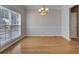 Bright dining room with hardwood floors and a chandelier, offering natural light at 124 Sweet Alyssum Dr, Ladson, SC 29456