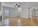 Bright living room with hardwood floors, fireplace, and access to kitchen at 124 Sweet Alyssum Dr, Ladson, SC 29456