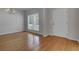 Formal dining room features hardwood floors and large window with blinds at 124 Sweet Alyssum Dr, Ladson, SC 29456