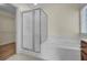 Bathroom with soaking tub, shower, and closet access at 124 Sweet Alyssum Dr, Ladson, SC 29456