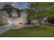 Two story house with front porch and attached garage at 124 Sweet Alyssum Dr, Ladson, SC 29456
