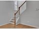 Elegant staircase with wooden handrail and hardwood floors at 124 Sweet Alyssum Dr, Ladson, SC 29456