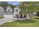 Two story house with front porch and attached garage at 124 Sweet Alyssum Dr, Ladson, SC 29456