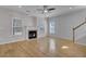 Spacious living room with hardwood floors, fireplace and staircase at 124 Sweet Alyssum Dr, Ladson, SC 29456