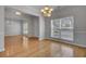 Spacious dining room with hardwood floors and views to the entry and living room at 124 Sweet Alyssum Dr, Ladson, SC 29456