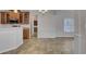 Spacious dining area with tile floors and an adjacent kitchen with wood cabinets at 124 Sweet Alyssum Dr, Ladson, SC 29456