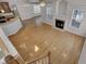 Open living room with hardwood floors, fireplace, and views into kitchen and dining areas at 124 Sweet Alyssum Dr, Ladson, SC 29456