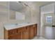 Double vanity bathroom with mirror and access to bedroom at 124 Sweet Alyssum Dr, Ladson, SC 29456