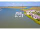 Aerial view of a marina next to waterfront homes at 2 Mcdonough Rd # F-2, Folly Beach, SC 29439