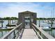 Wooden walkway leading to a gated private boat dock at 2 Mcdonough Rd # F-2, Folly Beach, SC 29439