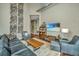 Open living room with leather sofas and high ceilings at 150 Bee St # 815, Charleston, SC 29401