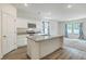 Kitchen with white cabinets, granite countertops, and an island at 4383 Ocean Farm Dr, Summerville, SC 29485