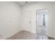Bright entryway with white door, carpet, and wood-look flooring at 4383 Ocean Farm Dr, Summerville, SC 29485
