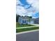 Newly built home with light blue siding, white garage door, and landscaped front yard at 4383 Ocean Farm Dr, Summerville, SC 29485