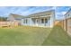 Spacious backyard with a patio and wooden privacy fence at 4383 Ocean Farm Dr, Summerville, SC 29485