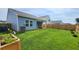 Large backyard with grass and wooden fence at 4383 Ocean Farm Dr, Summerville, SC 29485