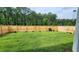 Spacious backyard with wooden fence and trees at 4383 Ocean Farm Dr, Summerville, SC 29485
