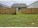 Backyard with wooden fence and access gate at 4383 Ocean Farm Dr, Summerville, SC 29485