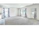 Bright living room featuring grey carpeting and backyard access at 4383 Ocean Farm Dr, Summerville, SC 29485