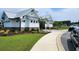 Relaxing community pool with lounge chairs and patio tables at 4383 Ocean Farm Dr, Summerville, SC 29485