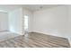 Open living room with wood-look flooring and neutral decor at 4383 Ocean Farm Dr, Summerville, SC 29485