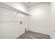 Laundry room with wire shelving, white walls and wood-look flooring at 4383 Ocean Farm Dr, Summerville, SC 29485
