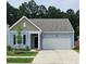 Beautiful light blue house with a two-car garage and well-manicured lawn at 4383 Ocean Farm Dr, Summerville, SC 29485