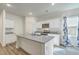 Modern kitchen with white cabinets, granite countertops, and stainless steel appliances at 4383 Ocean Farm Dr, Summerville, SC 29485