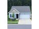 Newly built light blue house with two-car garage at 4383 Ocean Farm Dr, Summerville, SC 29485