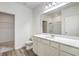 Modern bathroom with white vanity, toilet, and access to a walk-in closet at 4383 Ocean Farm Dr, Summerville, SC 29485