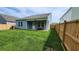 Backyard with patio, grass, and wooden fence at 4383 Ocean Farm Dr, Summerville, SC 29485