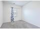 Bright bedroom with grey carpet and window with blue curtains at 4383 Ocean Farm Dr, Summerville, SC 29485