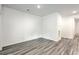 Empty spare bedroom with wood-look flooring and neutral walls at 4383 Ocean Farm Dr, Summerville, SC 29485