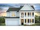 Two-story home with beige siding, black shutters, and a balcony at 340 Dickerson Ln, Summerville, SC 29485