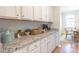 Kitchen features white cabinets, granite countertops and built-in coffee bar at 340 Dickerson Ln, Summerville, SC 29485