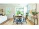 Charming dining area with round wooden table and four black chairs at 340 Dickerson Ln, Summerville, SC 29485