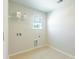 Convenient laundry room with shelving and window at 340 Dickerson Ln, Summerville, SC 29485