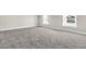 Spacious bedroom with grey carpet and two windows at 1089 Saltwater Cir, Johns Island, SC 29455