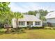 Quaint white cottage, deck, and nicely landscaped yard at 1135 Harborgate Dr, Mount Pleasant, SC 29464
