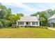 Charming white cottage with lush landscaping and deck at 1135 Harborgate Dr, Mount Pleasant, SC 29464
