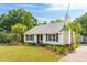 Cute bungalow with palm trees and well-manicured lawn at 1135 Harborgate Dr, Mount Pleasant, SC 29464