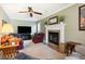 Relaxing living room with fireplace, ceiling fan, and comfortable seating at 1135 Harborgate Dr, Mount Pleasant, SC 29464