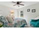 Bedroom with a queen bed, teal armchair and ceiling fan at 1135 Harborgate Dr, Mount Pleasant, SC 29464
