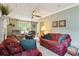 Spacious living room with fireplace, two comfy armchairs, and a sofa at 1135 Harborgate Dr, Mount Pleasant, SC 29464
