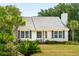 One-story home with white siding, shutters, and palm trees at 1135 Harborgate Dr, Mount Pleasant, SC 29464