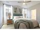 Light and airy bedroom with a green upholstered bed at 139 Dantzler Rd, Harleyville, SC 29448