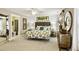 Main bedroom featuring a king-size bed, ensuite bathroom, and walk-in closet at 157 Collared Dove Ct, Summerville, SC 29483